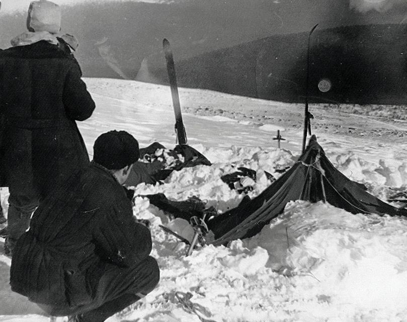 The Dyatlov group's tent as searchers found it in 1959, half buried in snow.